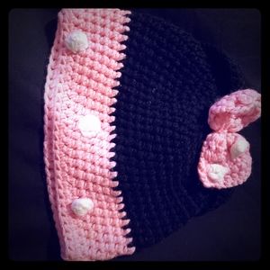 Newborn knitted hat . Pink/Black with bow .